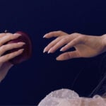 woman holding an apple